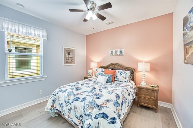 12740 Seaside Key Ct, North Fort Myers, FL 33903 - bedroom with wood finished floors and a ceiling fan