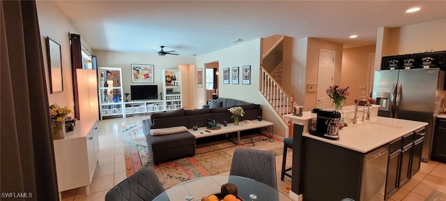 3268 Aralia Ct E, Alva, FL 33920 - living room featuring a ceiling fan, light tile patterned floors, stairs, and recessed lighting