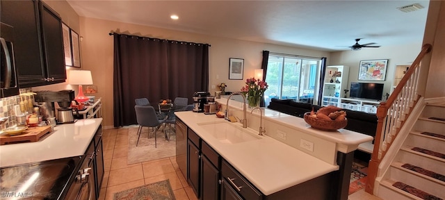 3268 Aralia Ct E, Alva, FL 33920 - kitchen with open floor plan, an island with sink, ceiling fan, light countertops, and recessed lighting