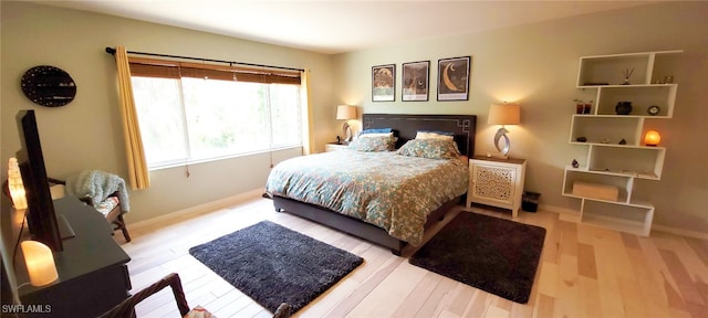 3268 Aralia Ct E, Alva, FL 33920 - bedroom with baseboards and wood finished floors