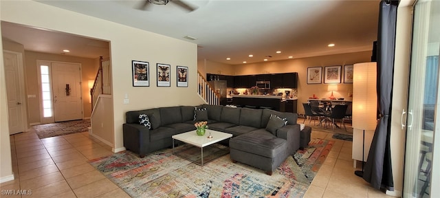 3268 Aralia Ct E, Alva, FL 33920 - living room with light tile patterned floors, stairway, recessed lighting, and ceiling fan