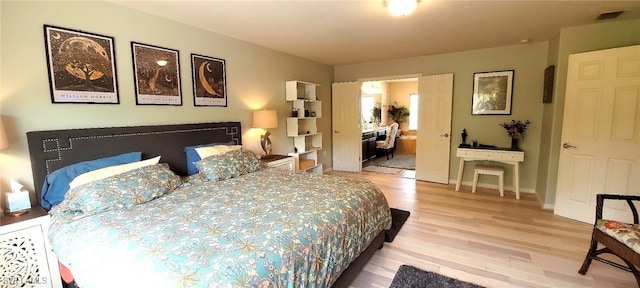 3268 Aralia Ct E, Alva, FL 33920 - bedroom featuring light wood-style flooring and baseboards