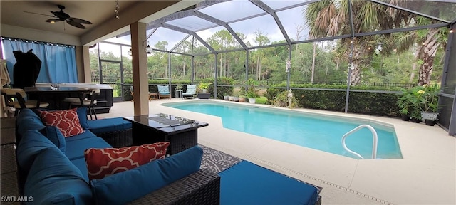 3268 Aralia Ct E, Alva, FL 33920 - swimming pool featuring an outdoor hangout area, a patio, a ceiling fan, and glass enclosure