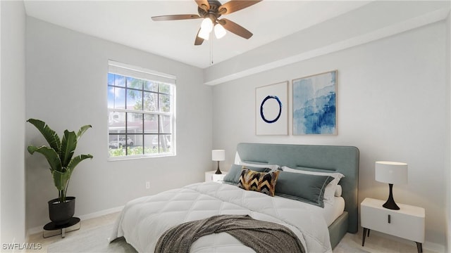 bedroom with a ceiling fan and baseboards