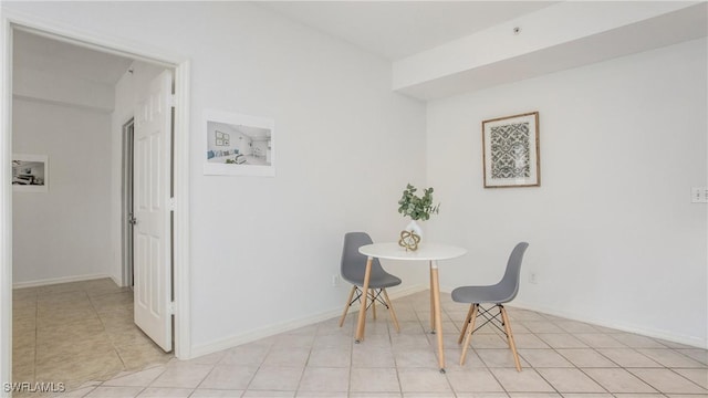 dining area featuring baseboards and light tile patterned floors