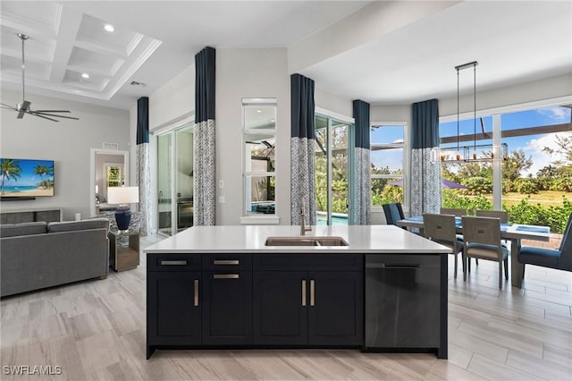 641 Diplomat Ct, Marco Island, FL 34145 - kitchen with a sink, light countertops, dark cabinetry, dishwashing machine, and coffered ceiling