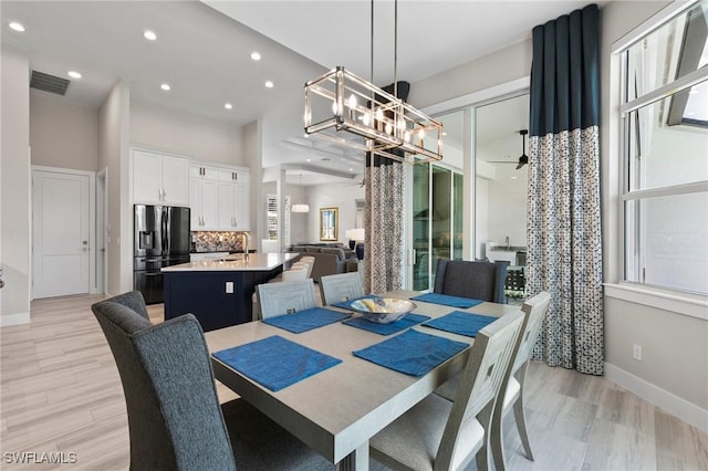 641 Diplomat Ct, Marco Island, FL 34145 - dining area featuring visible vents, light wood-type flooring, plenty of natural light, and a notable chandelier