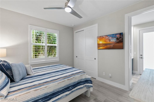 641 Diplomat Ct, Marco Island, FL 34145 - bedroom with a closet, baseboards, light wood finished floors, and ceiling fan