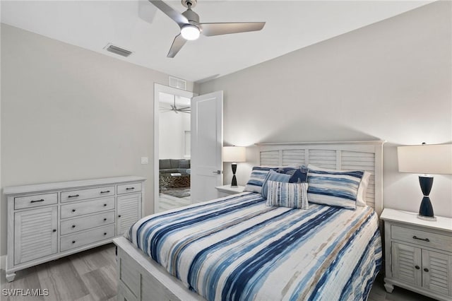 641 Diplomat Ct, Marco Island, FL 34145 - bedroom featuring visible vents, a ceiling fan, and wood finished floors