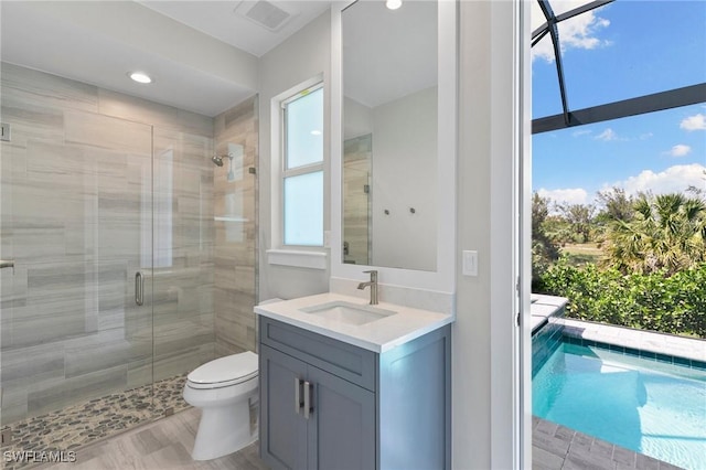 641 Diplomat Ct, Marco Island, FL 34145 - bathroom with toilet, vanity, visible vents, and a stall shower