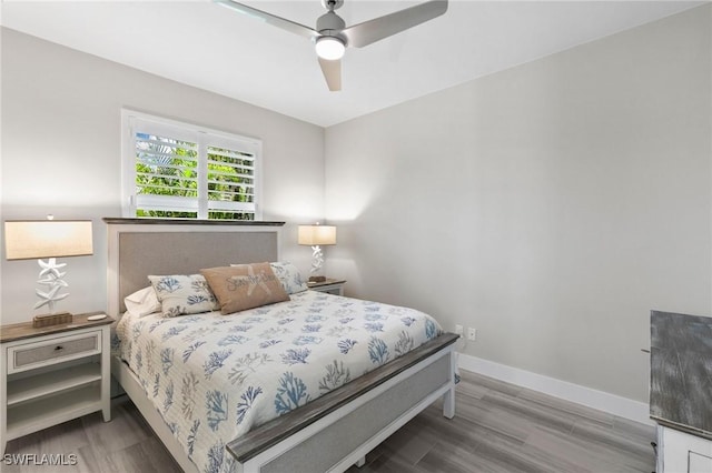 641 Diplomat Ct, Marco Island, FL 34145 - bedroom with wood finished floors, ceiling fan, and baseboards