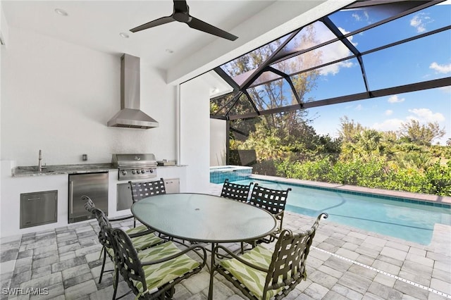 641 Diplomat Ct, Marco Island, FL 34145 - view of patio / terrace with a sink, an outdoor kitchen, grilling area, an outdoor pool, and a lanai
