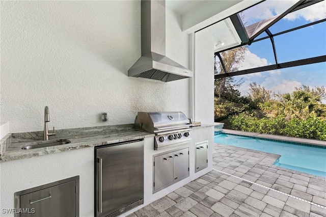 641 Diplomat Ct, Marco Island, FL 34145 - view of patio featuring an outdoor kitchen, an outdoor pool, grilling area, glass enclosure, and a sink