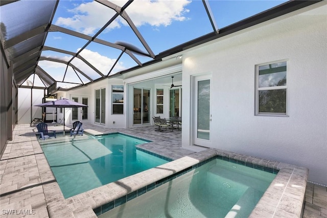 641 Diplomat Ct, Marco Island, FL 34145 - outdoor pool with a patio area, ceiling fan, an in ground hot tub, and glass enclosure