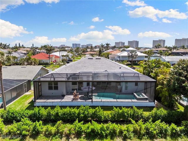 641 Diplomat Ct, Marco Island, FL 34145 - rear view of house with an outdoor pool and a lanai