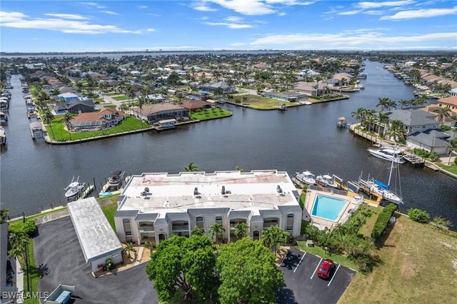 bird's eye view with a residential view and a water view