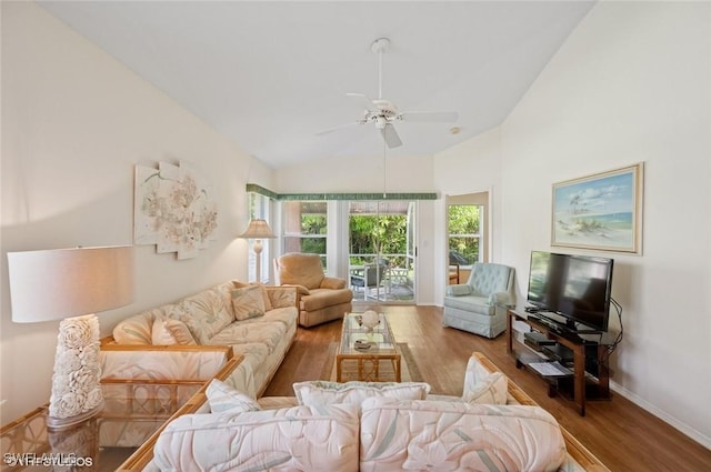 20902 Blacksmith Frg, Estero, FL 33928 - living area featuring wood finished floors, vaulted ceiling, baseboards, and ceiling fan