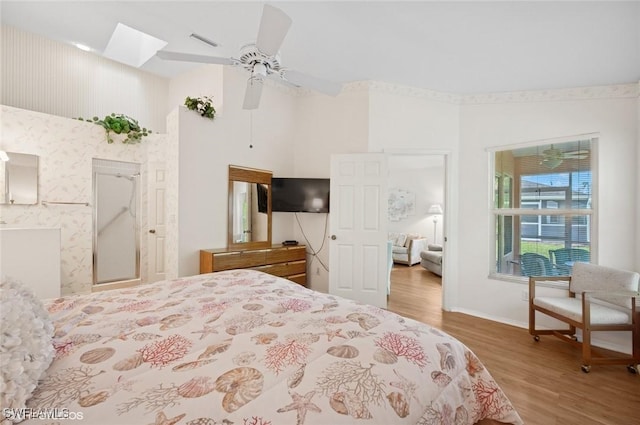 20902 Blacksmith Frg, Estero, FL 33928 - bedroom featuring wood finished floors, baseboards, a high ceiling, ensuite bathroom, and a ceiling fan