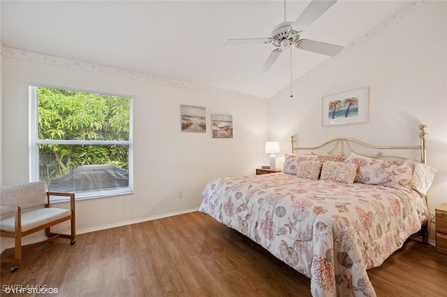20902 Blacksmith Frg, Estero, FL 33928 - bedroom with vaulted ceiling, wood finished floors, baseboards, and ceiling fan
