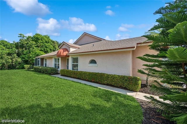 20902 Blacksmith Frg, Estero, FL 33928 - view of front facade featuring stucco siding and a front lawn