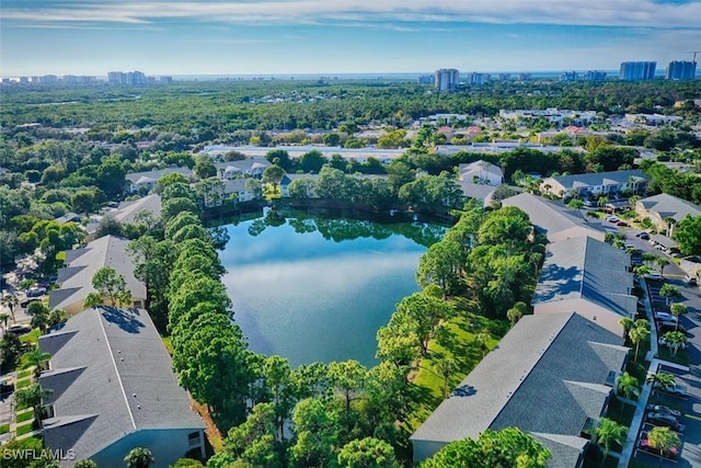 birds eye view of property with a water view and a residential view