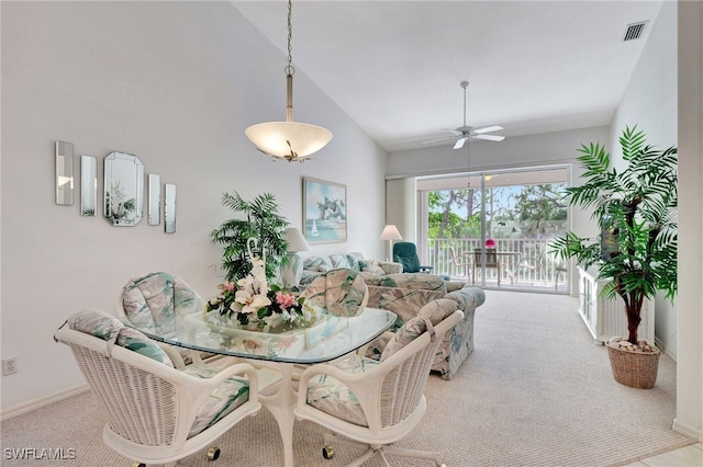 1180 Sarah Jean Cir Unit G202, Naples, FL 34110 - dining room featuring carpet flooring, a ceiling fan, baseboards, and high vaulted ceiling