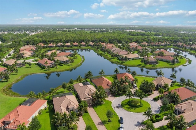 birds eye view of property with a water view and a residential view