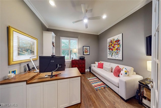 office with ornamental molding, ceiling fan, and wood finished floors