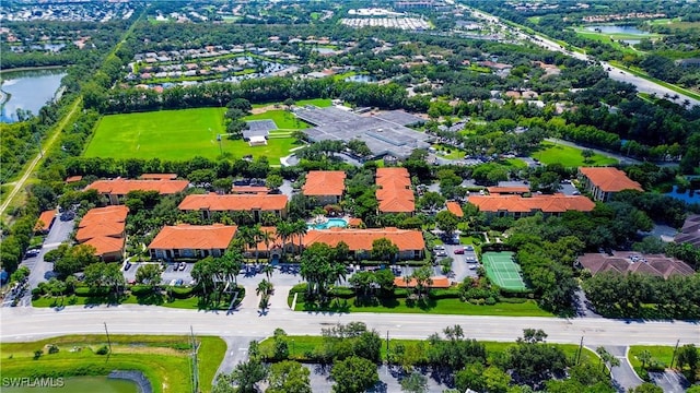 bird's eye view with a water view and a residential view