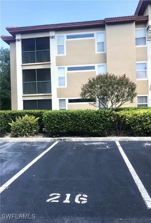 view of property with uncovered parking