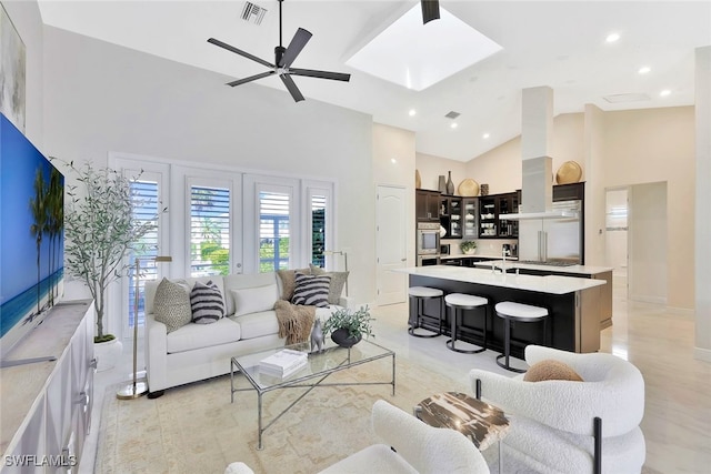 27080 Flamingo Dr, Bonita Springs, FL 34135 - living area with ceiling fan, high vaulted ceiling, recessed lighting, a skylight, and visible vents