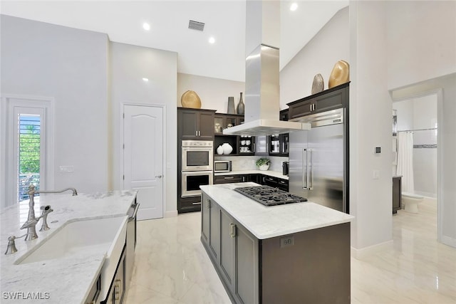 27080 Flamingo Dr, Bonita Springs, FL 34135 - kitchen with visible vents, marble finish floor, light stone countertops, a sink, and appliances with stainless steel finishes