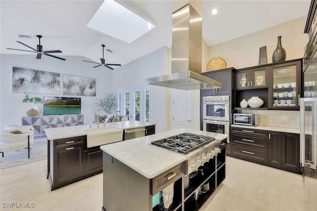 27080 Flamingo Dr, Bonita Springs, FL 34135 - kitchen with a sink, a kitchen island, island exhaust hood, a ceiling fan, and stainless steel appliances