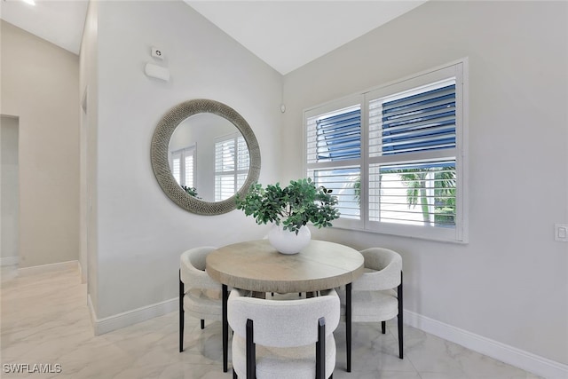 27080 Flamingo Dr, Bonita Springs, FL 34135 - dining space featuring baseboards, marble finish floor, and vaulted ceiling