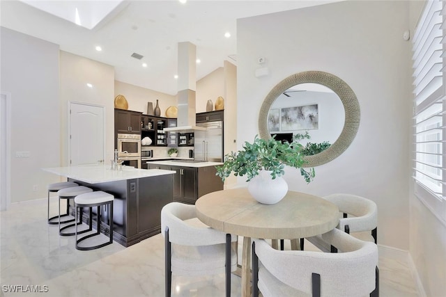 27080 Flamingo Dr, Bonita Springs, FL 34135 - dining space featuring visible vents, marble finish floor, baseboards, high vaulted ceiling, and recessed lighting