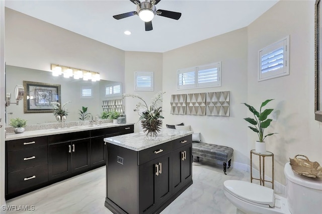 27080 Flamingo Dr, Bonita Springs, FL 34135 - bathroom featuring ceiling fan, vanity, toilet, marble finish floor, and baseboards