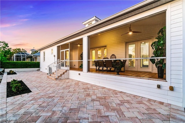 27080 Flamingo Dr, Bonita Springs, FL 34135 - patio terrace at dusk with french doors