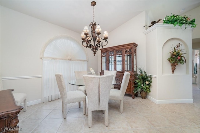 5131 SW 19th Ave, Cape Coral, FL 33914 - tiled dining area with high vaulted ceiling, an inviting chandelier, and baseboards