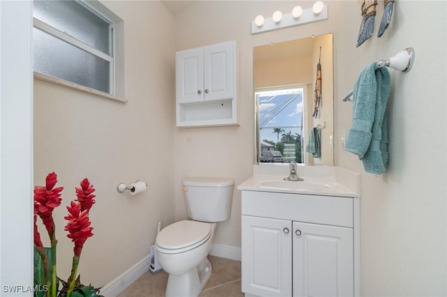 5131 SW 19th Ave, Cape Coral, FL 33914 - half bathroom featuring tile patterned flooring, vanity, baseboards, and toilet