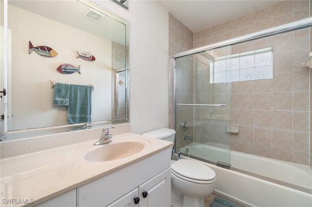 5131 SW 19th Ave, Cape Coral, FL 33914 - full bathroom featuring visible vents, toilet, vanity, and enclosed tub / shower combo