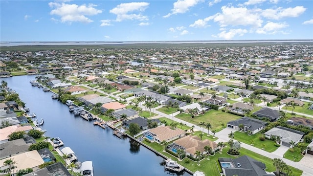 5131 SW 19th Ave, Cape Coral, FL 33914 - drone / aerial view featuring a water view and a residential view