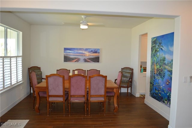 dining space with baseboards, wood finished floors, and ceiling fan