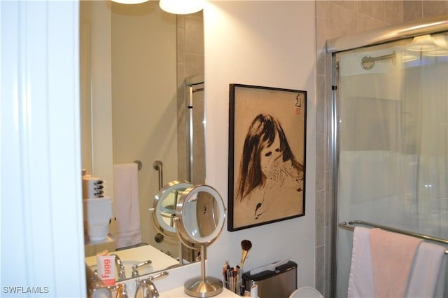 bathroom with a shower with door