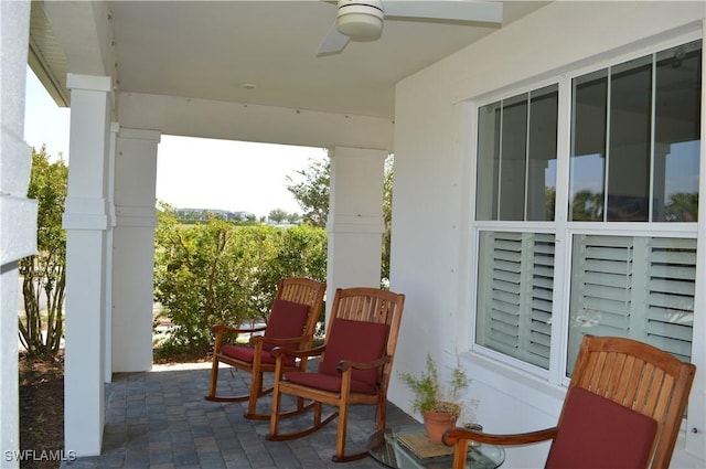balcony featuring a ceiling fan