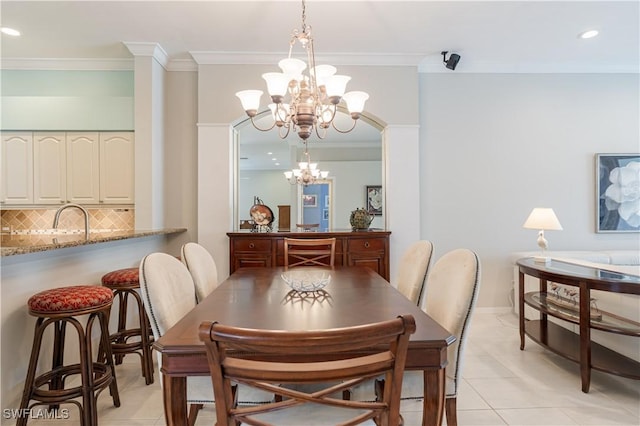 8815 Naples Heritage Dr Unit D9, Naples, FL 34112 - dining space with light tile patterned flooring, an inviting chandelier, ornamental molding, and recessed lighting