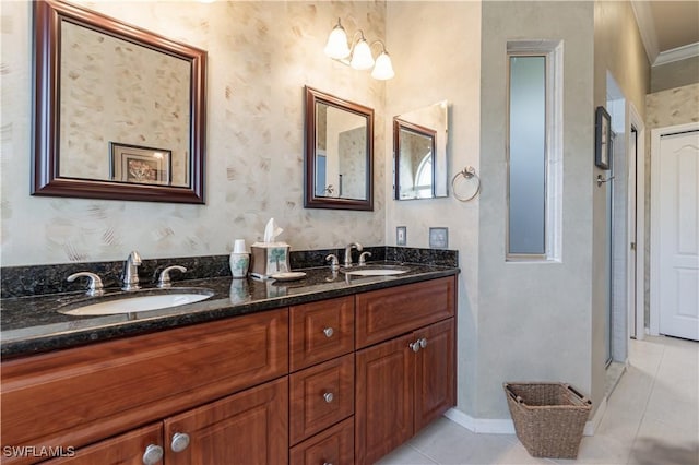 8815 Naples Heritage Dr Unit D9, Naples, FL 34112 - bathroom featuring a sink, tile patterned floors, double vanity, and wallpapered walls