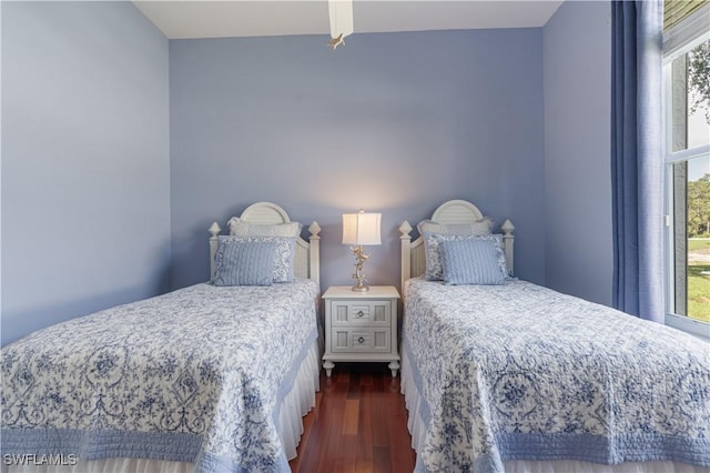 8815 Naples Heritage Dr Unit D9, Naples, FL 34112 - bedroom featuring dark wood-style flooring