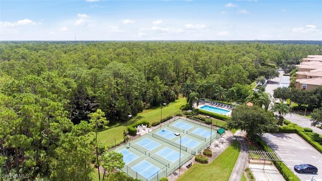 8815 Naples Heritage Dr Unit D9, Naples, FL 34112 - bird's eye view with a forest view