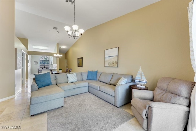 28750 Diamond Dr Unit 205, Bonita Springs, FL 34134 - living area with visible vents, vaulted ceiling, baseboards, a notable chandelier, and light tile patterned flooring