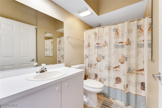 28750 Diamond Dr Unit 205, Bonita Springs, FL 34134 - bathroom with toilet, a shower with shower curtain, tile patterned flooring, and vanity